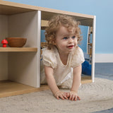 Whitney Brothers elevatED Discovery Crawl Thru Cabinet Toddler Discovery Cabinet - toddler crawling through cabinet detail