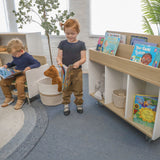 Whitney Brothers elevatED Mobile Book Storage Island Mobile Book Storage Island - classroom lifestyle view with children reading nearby