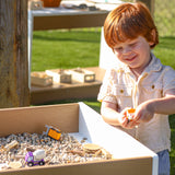 Whitney Brothers outdoorED Big and Wide Table Outdoor Sensory Play Table - outdoor detail with child exploring materials